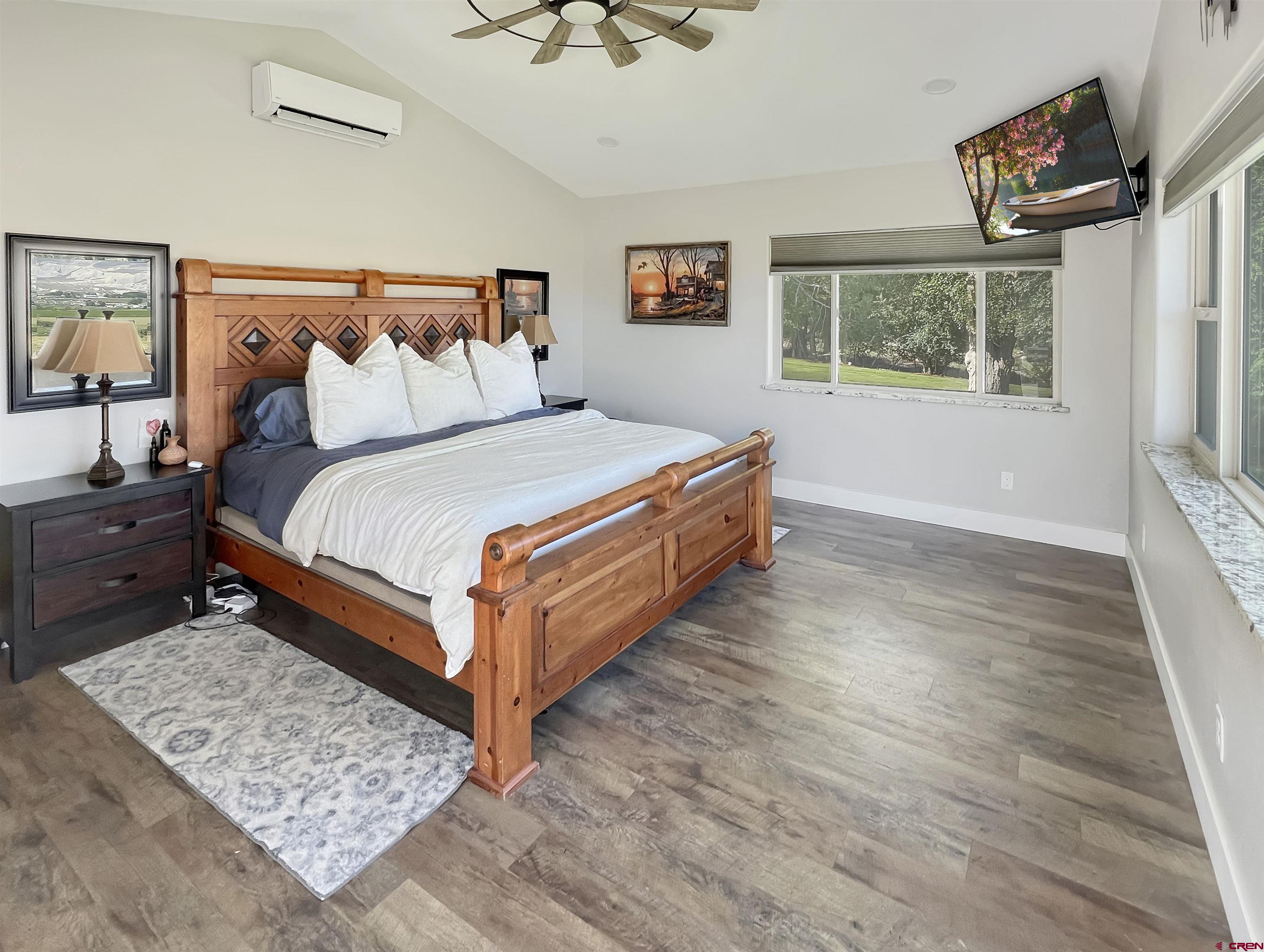 14332 G Road Delta, CO 81416 - Photo 29 of 35 a bed sitting in a bedroom next to a window