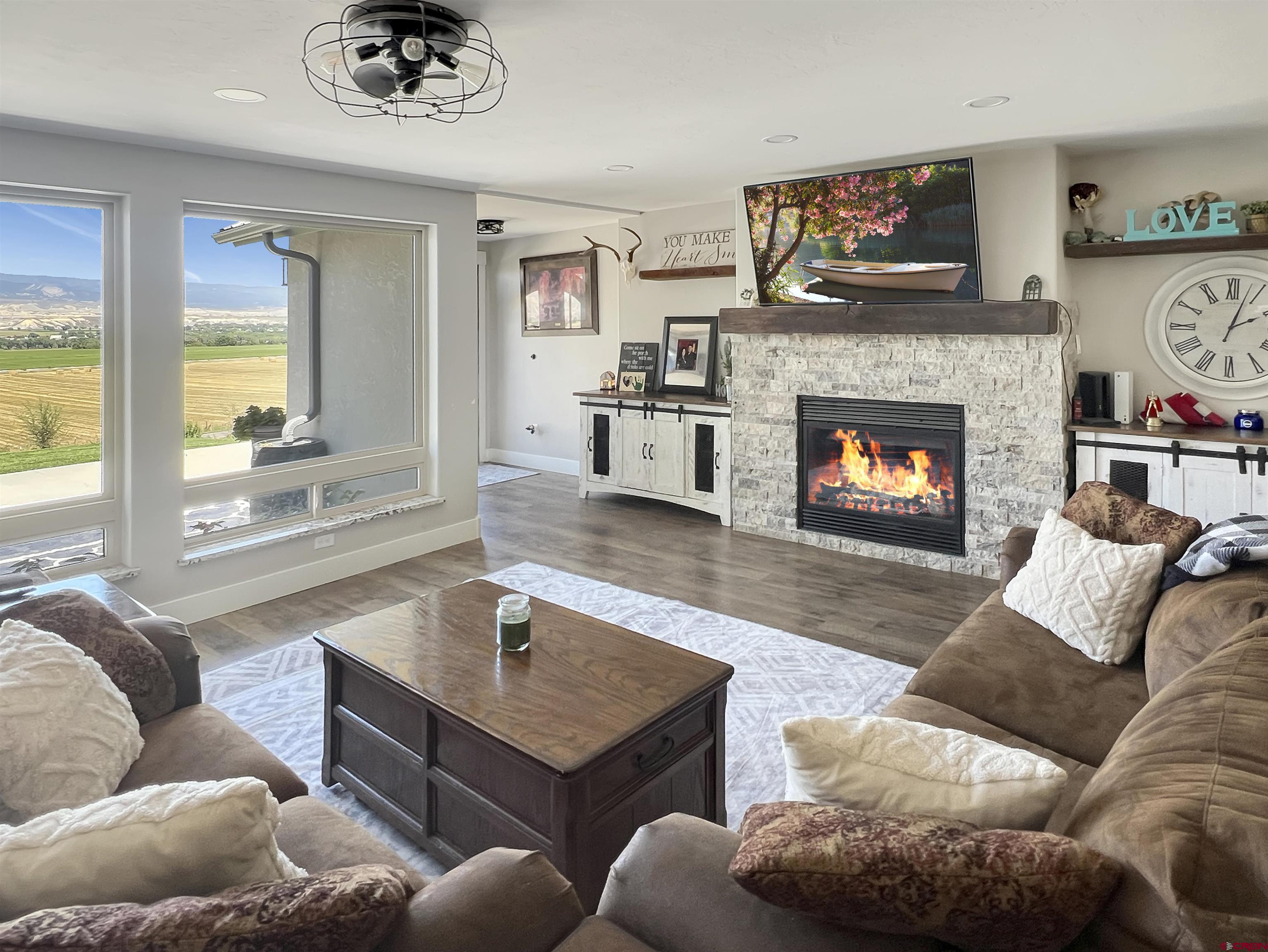 14332 G Road Delta, CO 81416 - Photo 7 of 35 a living room with furniture and a fireplace