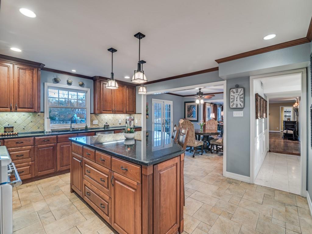 343 East Tripp Road Sunnyvale, TX 75182 - Photo 15 of 36 a kitchen with stainless steel appliances granite countertop a sink and cabinets