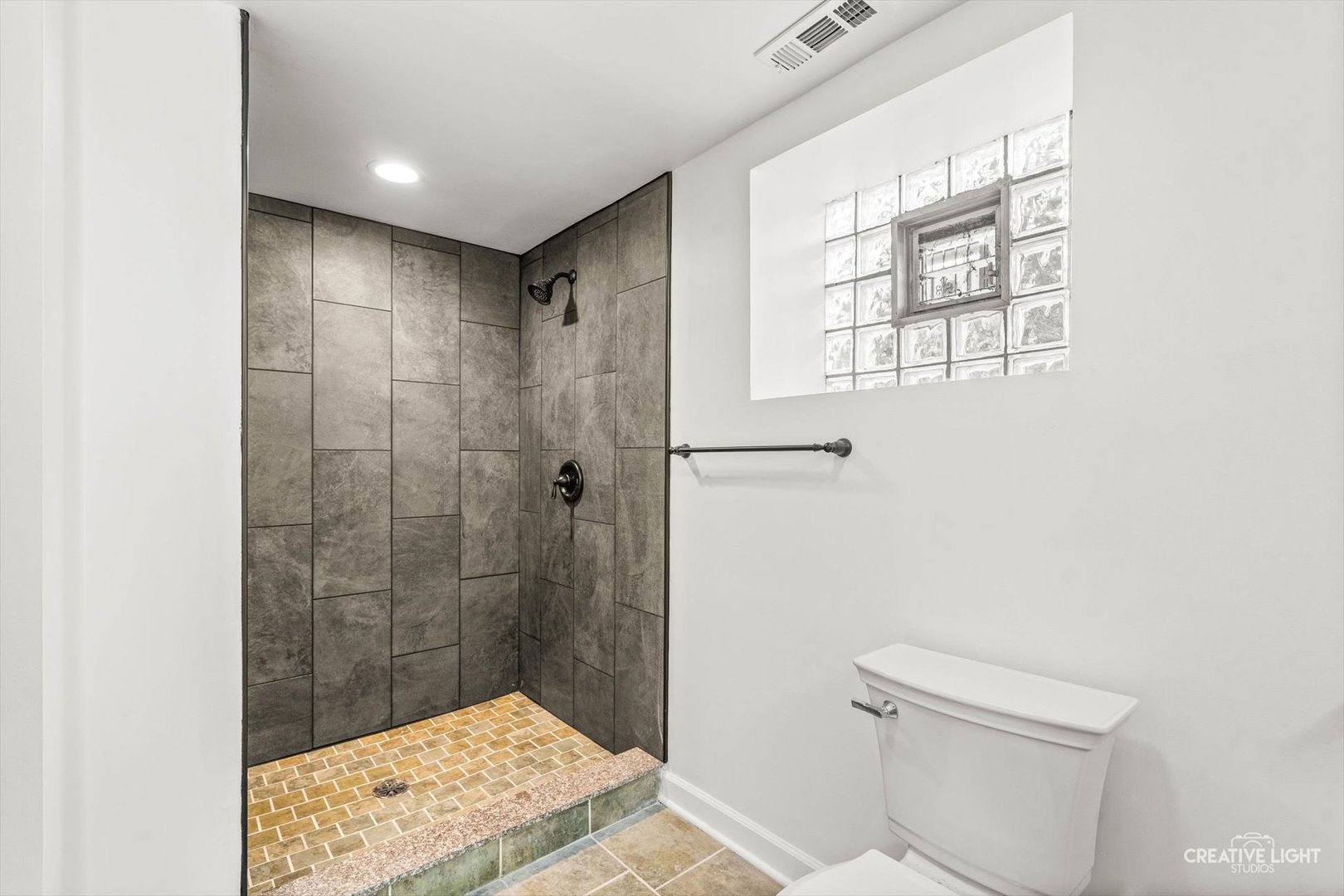 7724 South Chappel Avenue Chicago, IL 60649 - Photo 16 of 22 a bathroom with a shower toilet and sink