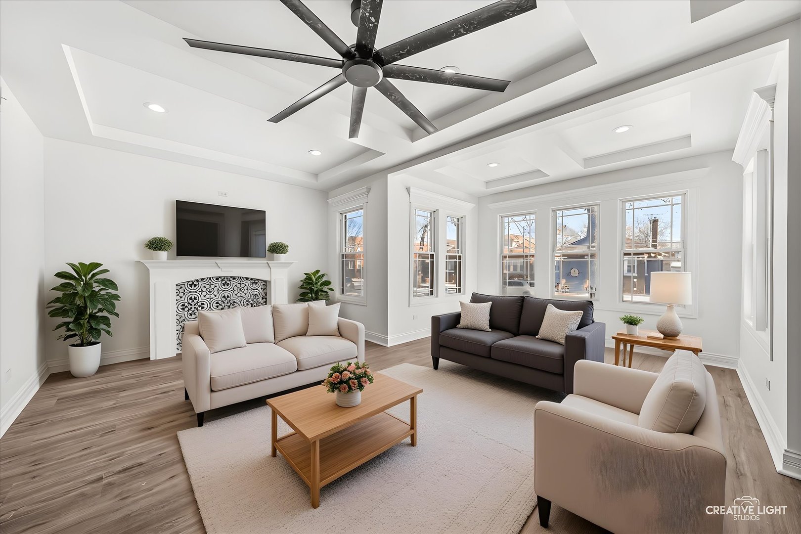 7724 South Chappel Avenue Chicago, IL 60649 - Photo 3 of 22 a living room with furniture a flat screen tv and a potted plant