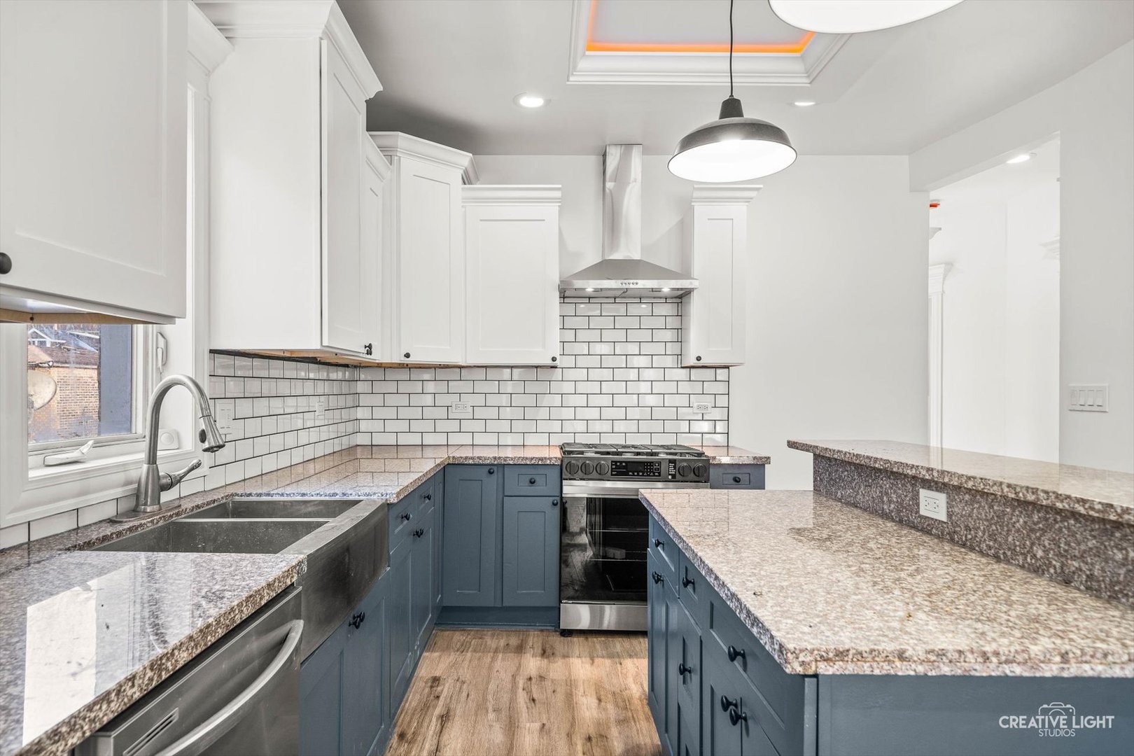 7724 South Chappel Avenue Chicago, IL 60649 - Photo 8 of 22 a kitchen with granite countertop a sink stove and cabinets