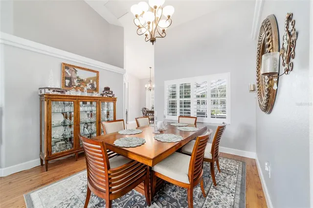 a living room with furniture or couch and a chandelier