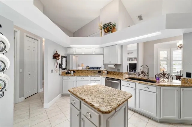 a view of walk in closet with clothes