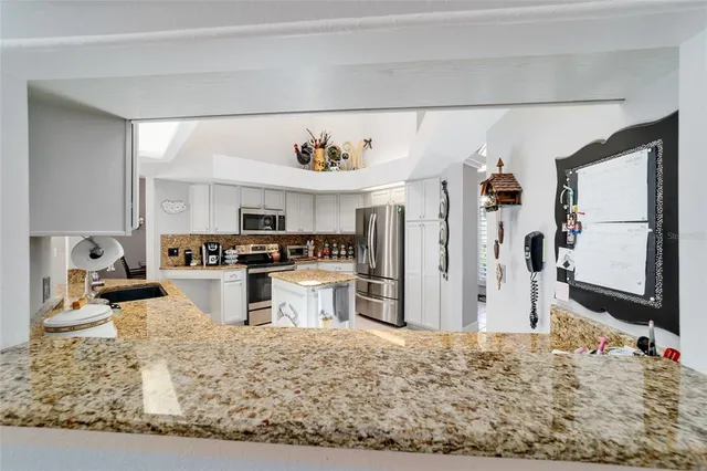 a spacious bathroom with a double vanity sink toilet and shower