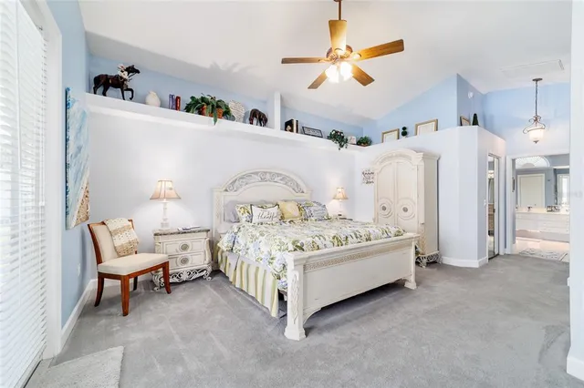 a bathroom with a sink a toilet a mirror and shower