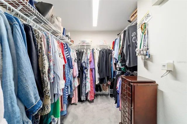 a view of a patio with a table and chairs