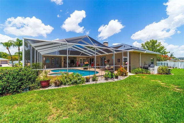 a view of living room with furniture and floor to ceiling window