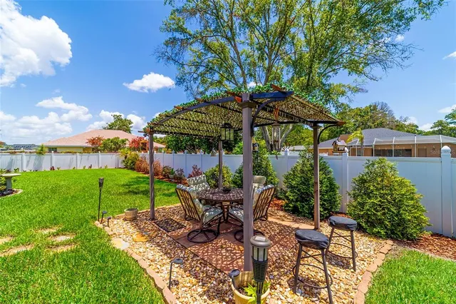 a hall with kitchen island granite countertop a large stove top oven