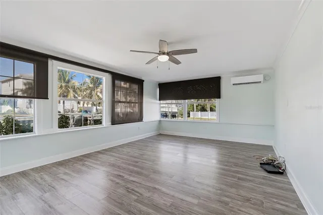 a view of a livingroom with furniture window and wooden floor