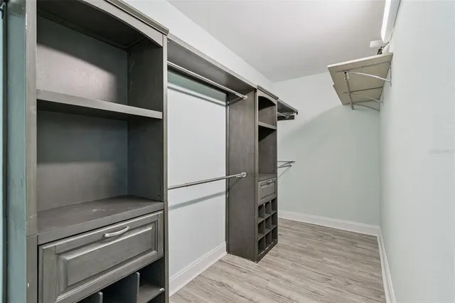 a kitchen with a refrigerator and a stove