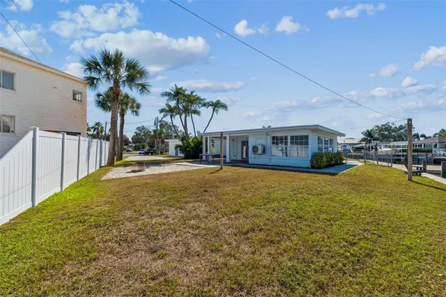 a house view with swimming pool in front of it