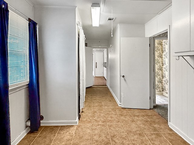 412 Neal Street Jasper, TX 75951 - Photo 8 of 22 a view of a bathroom with a walk in closet and wooden floor