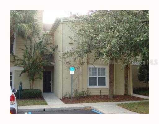 416 Summit Ridge Place, Unit 210 Longwood, FL 32779 - Photo 1 of 1 a front view of a house with a yard