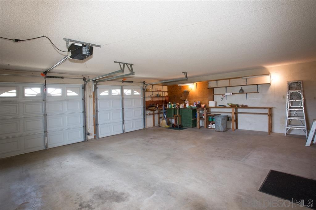10459 Loma Rancho Drive Spring Valley, CA 91978 - Photo 22 of 25 Oversize two car garage with plenty of space for workbenches and/or storage on top of parking two cars inside the garage.