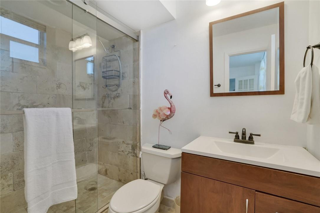 5500 Northwest 2nd Avenue, Unit 119 Boca Raton, FL 33487 - Photo 17 of 22 a bathroom with a sink a toilet and shower