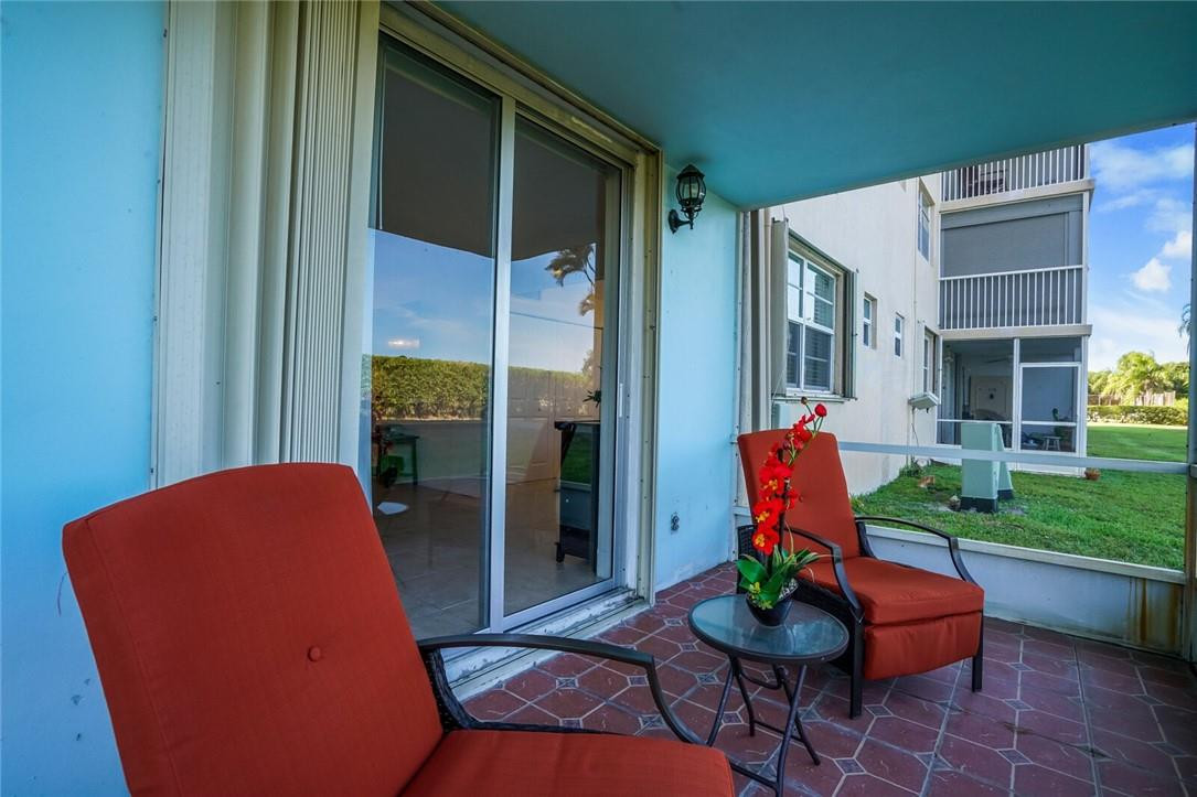 5500 Northwest 2nd Avenue, Unit 119 Boca Raton, FL 33487 - Photo 18 of 22 a backyard of a house with outdoor seating