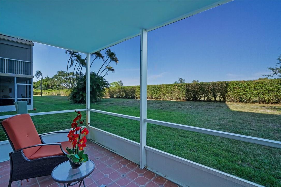 5500 Northwest 2nd Avenue, Unit 119 Boca Raton, FL 33487 - Photo 19 of 22 a view of a porch with furniture and a yard