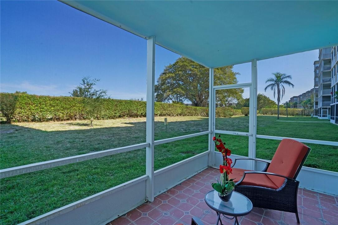 5500 Northwest 2nd Avenue, Unit 119 Boca Raton, FL 33487 - Photo 20 of 22 a view of a porch with furniture and yard
