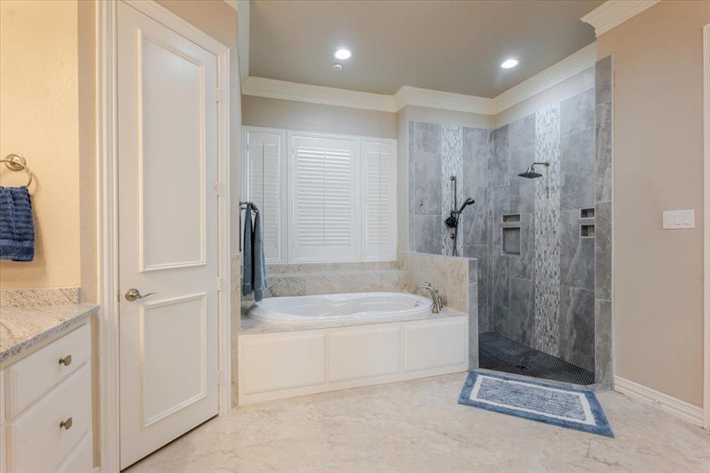 166 East Rio Ridge Azle, TX 76020 - Photo 21 of 40 a bathroom with a shower a bathtub and a shower