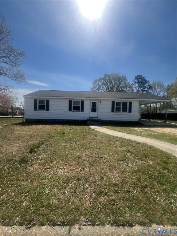 a view of building with yard and ocean view