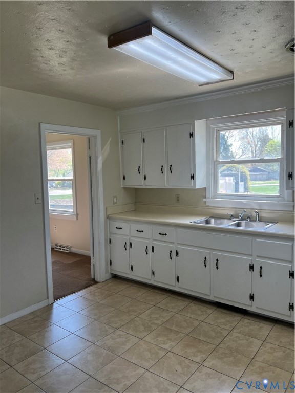 3000 Clark Street Hopewell, VA 23860 - Photo 11 of 18 a kitchen with granite countertop white cabinets and window
