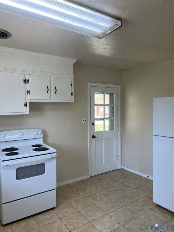 3000 Clark Street Hopewell, VA 23860 - Photo 10 of 18 a kitchen with white cabinets and white appliances