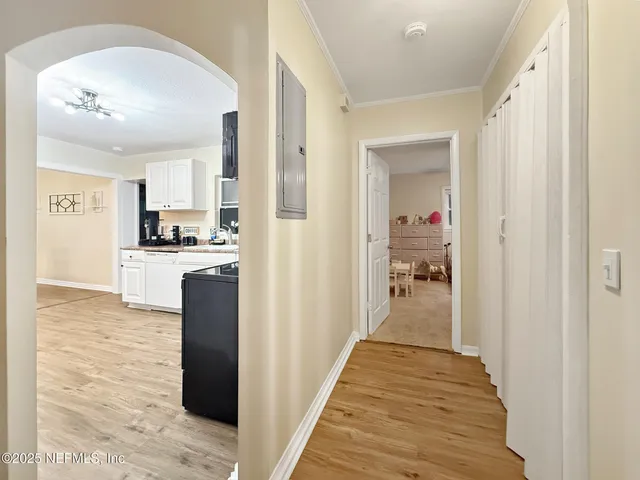 a view of a kitchen from the hallway