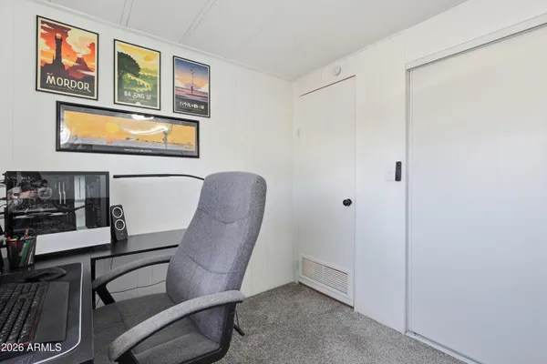 a workspace with furniture and lamp