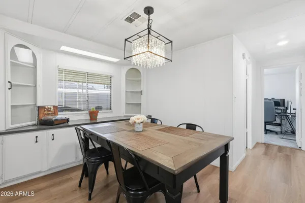 a view of a dining room with furniture window and wooden floor
