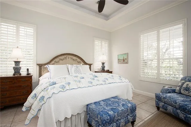 a bedroom with a bed couch and window