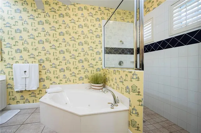 a bathroom with a bathtub and shower