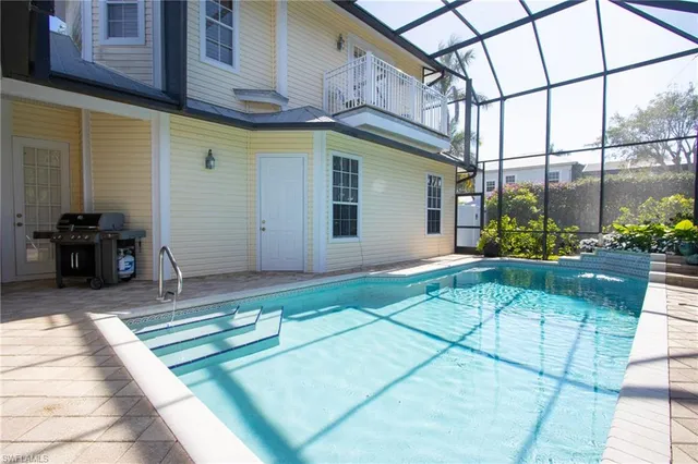 a view of a house with potted plants