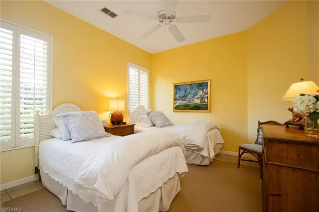 a bedroom with bed and window