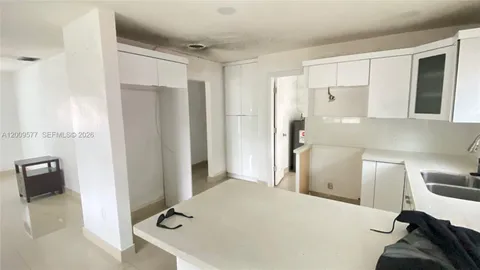 a en suite bathroom with a sink and a shower