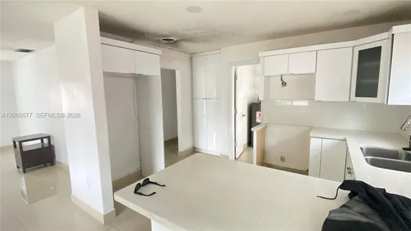 a en suite bathroom with a sink and a shower