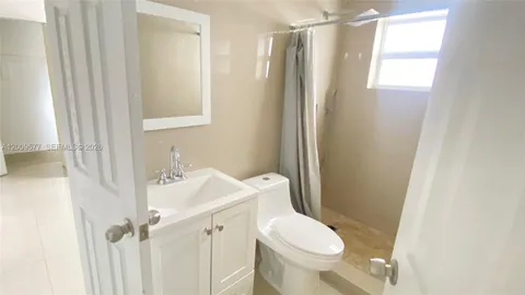 a bathroom with a sink and a toilet