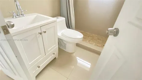 a bathroom with a sink and toilet