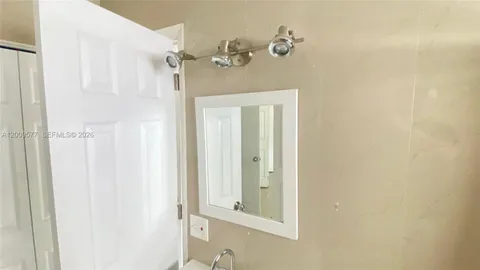a view of a bathroom with a sink and tub