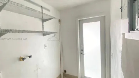 a bathroom with a shower and a window