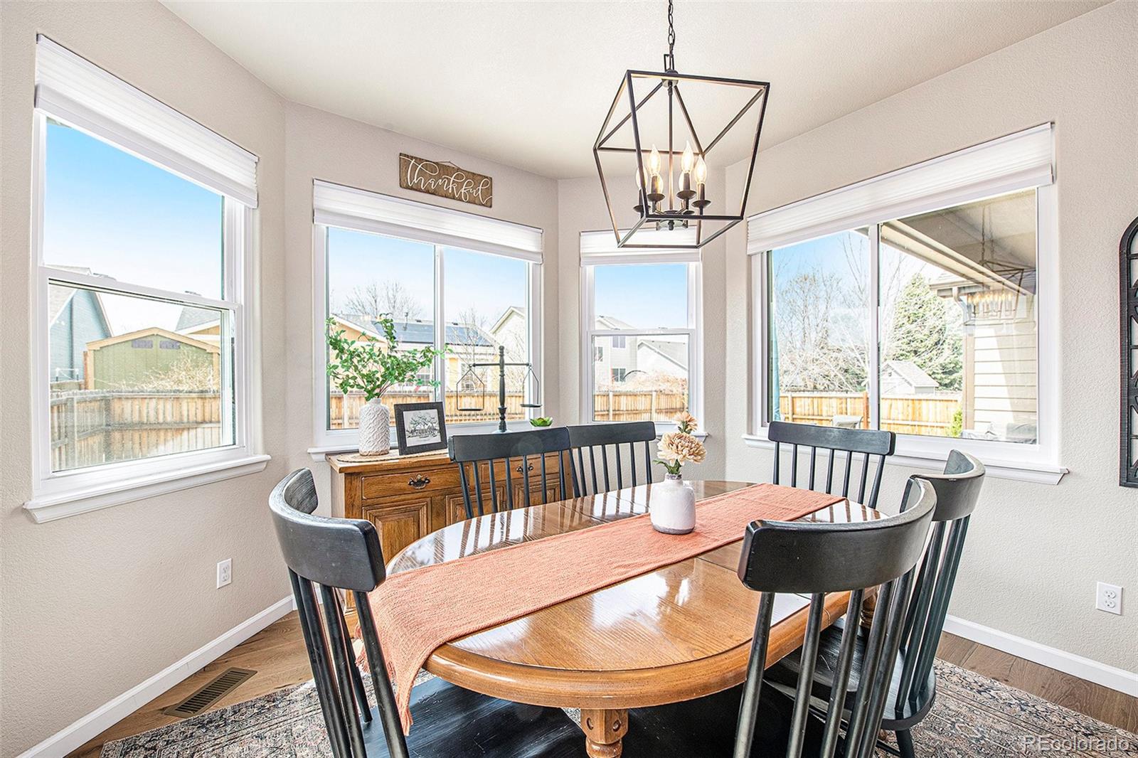 320 Granite Way Johnstown, CO 80534 - Photo 11 of 39 a view of a dining room with furniture window and outside view