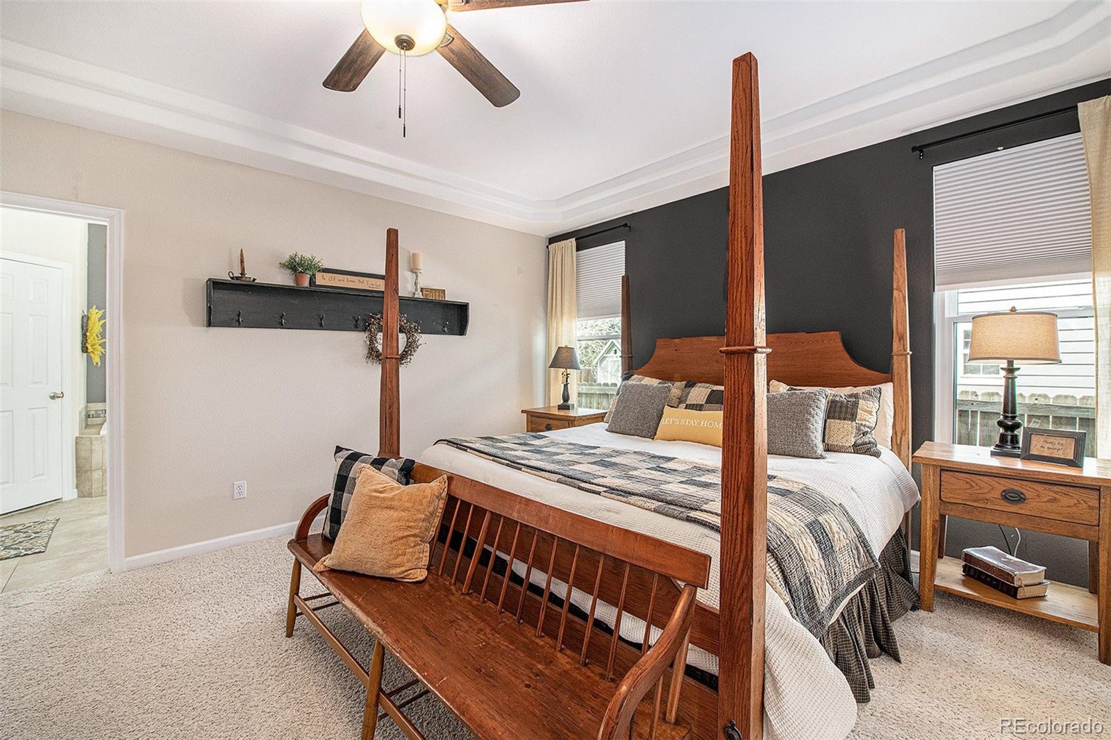 320 Granite Way Johnstown, CO 80534 - Photo 14 of 39 a bedroom with furniture and a large window