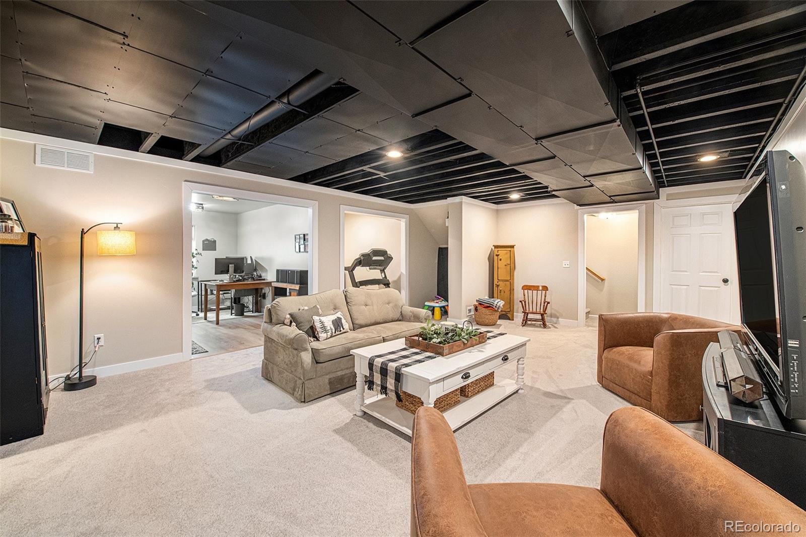 320 Granite Way Johnstown, CO 80534 - Photo 22 of 39 a living room with furniture or outdoor view and a large window