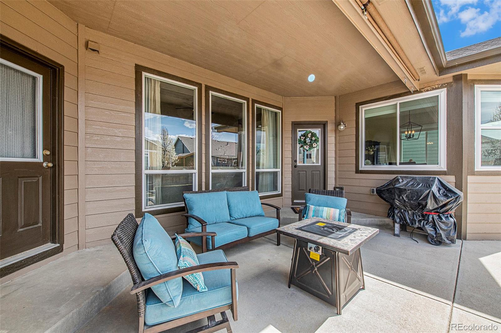 320 Granite Way Johnstown, CO 80534 - Photo 26 of 39 a living room with furniture and a window