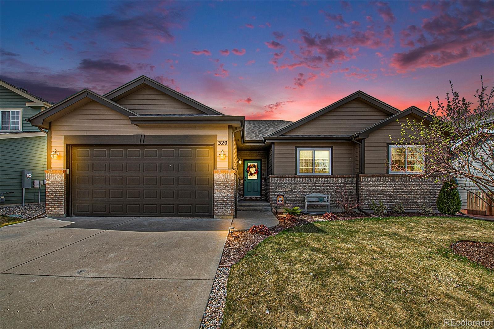 320 Granite Way Johnstown, CO 80534 - Photo 30 of 39 a front view of a house with a yard