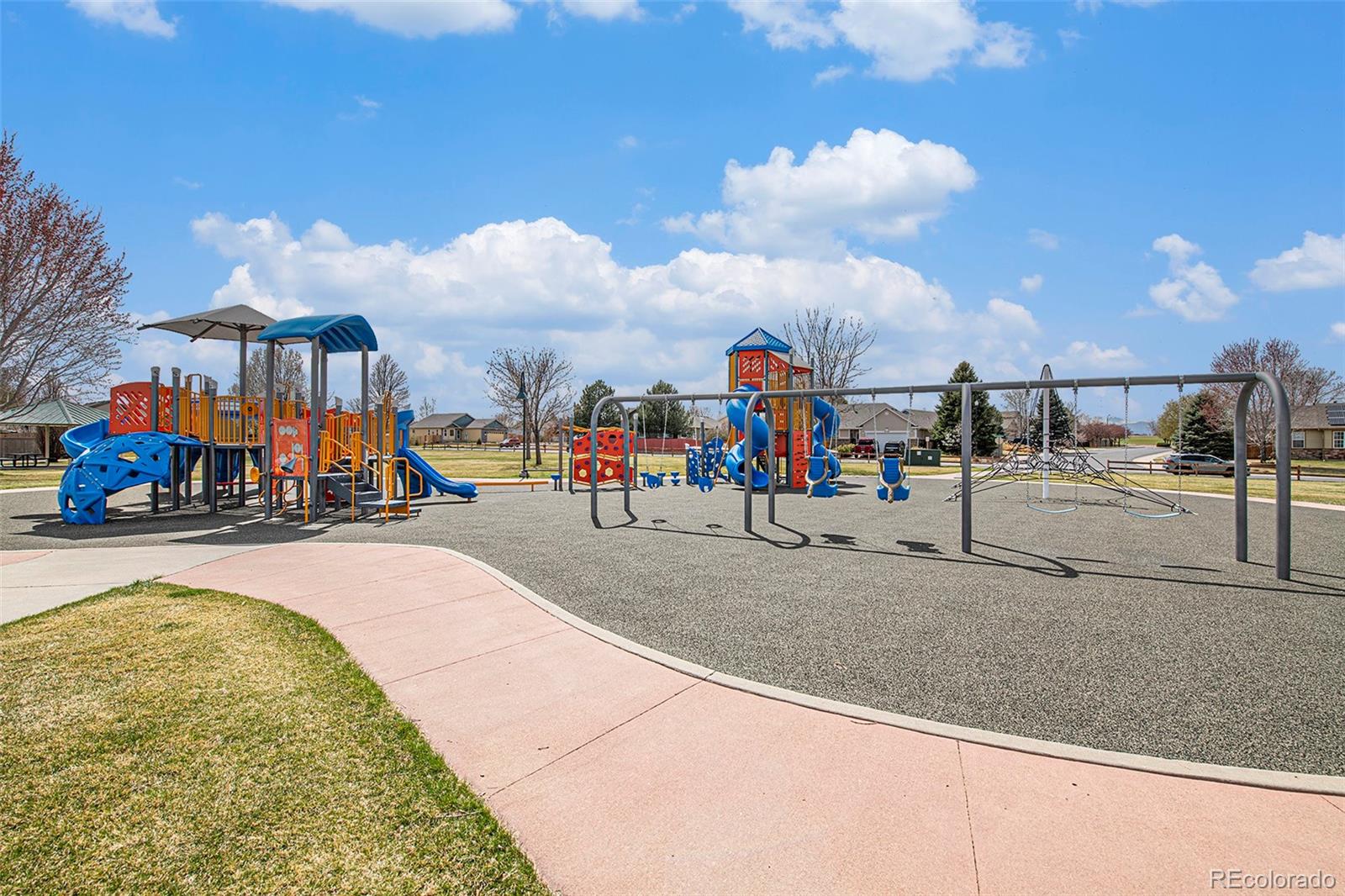 320 Granite Way Johnstown, CO 80534 - Photo 36 of 39 a group of people walking down a street