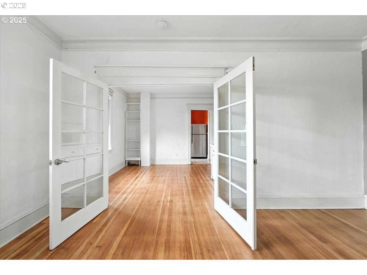 2109 Northwest Irving Street, Unit 304 Portland, OR 97210 - Photo 13 of 25 a view of wooden floor in a room