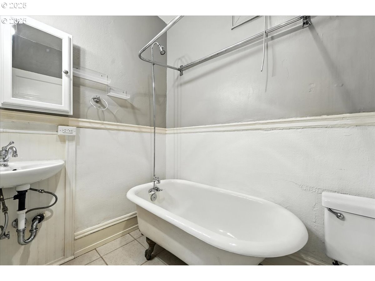 2109 Northwest Irving Street, Unit 304 Portland, OR 97210 - Photo 22 of 25 a bathroom with a sink and a bathtub