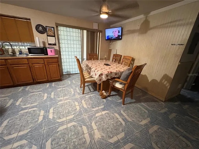 a dining room with furniture and window