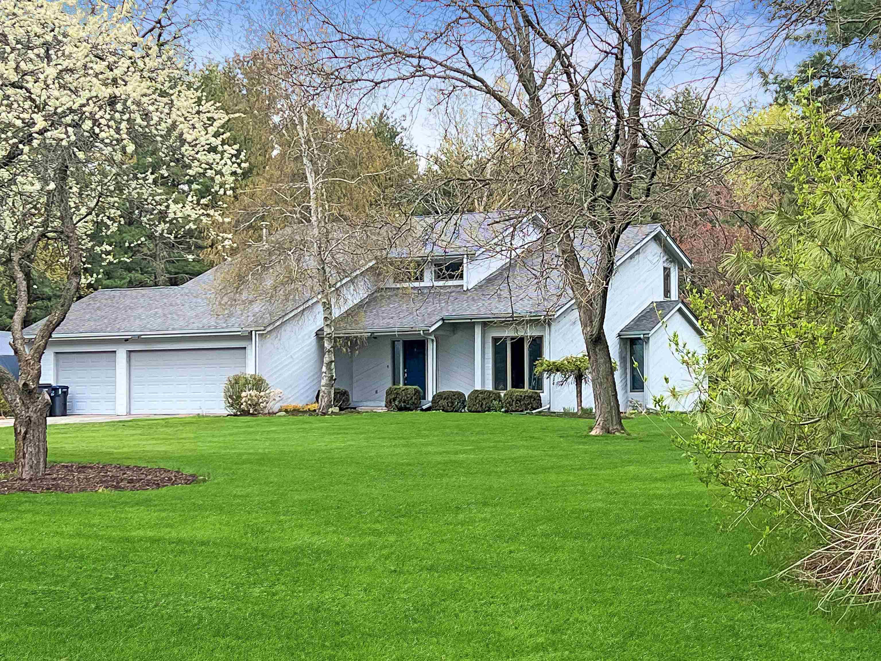 14 Spring Brook Road Rockford, IL 61114 - Photo 1 of 31 a front view of a house with a garden